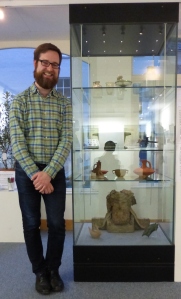 Dan with the objects from the British Museum. You can see the baby feeder in the bottom left-hand corner of the case.
